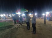 Personel Polsek Mambi Pastikan Keamanan Pasar Malam di Lapangan Sepak Bola Mambi