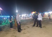Personel Polsek Mambi Monitoring dan Pengamanan Pasar Malam di Lapangan Sepak Bola