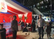 Personel Polsek Sendana Amankan Malam Pesta Rakyat Sandeq Silumba 2025 di Pantai Banua Sendana